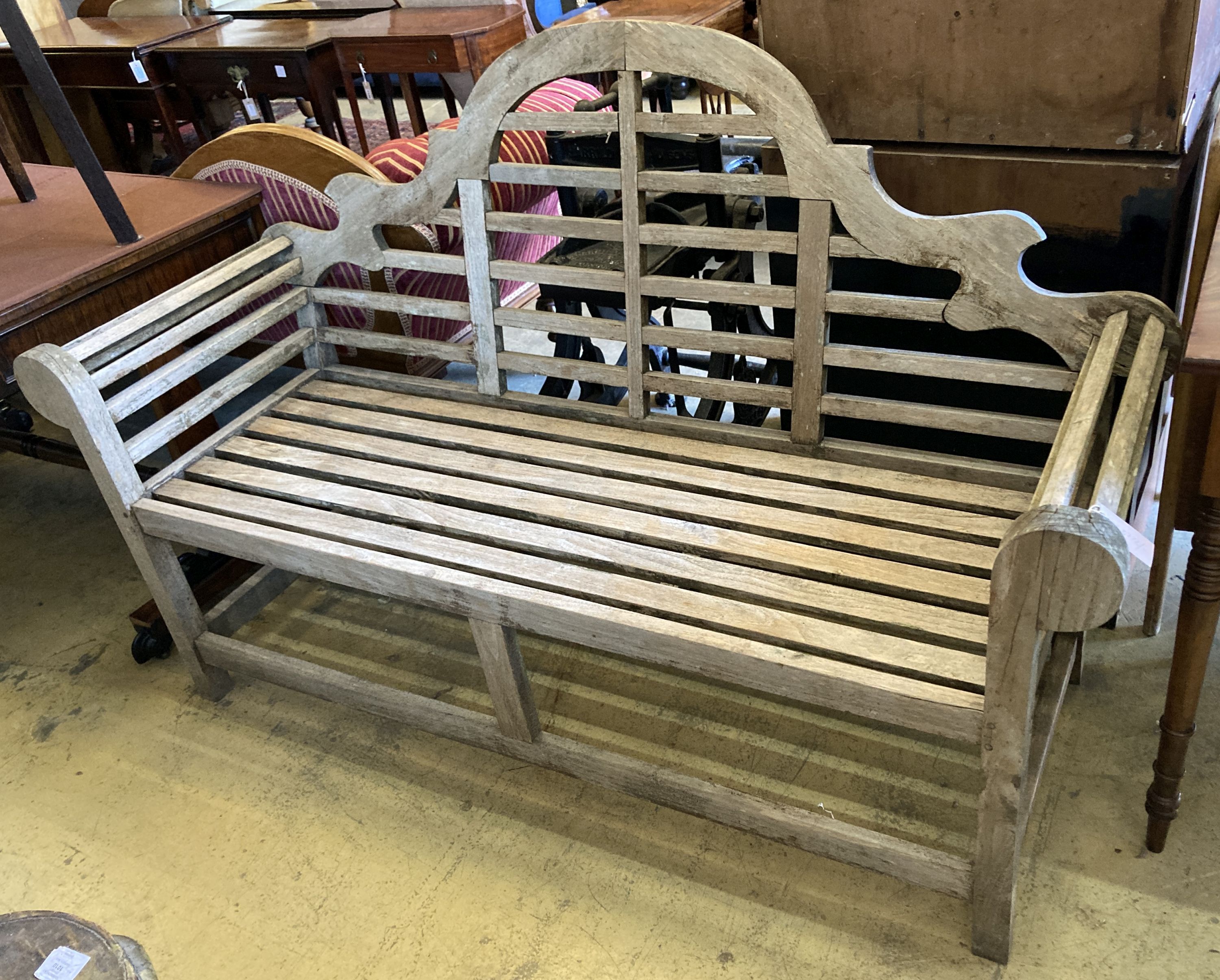 A Lutyens style weathered teak garden bench, length 166cm, depth 58cm, height 105cm